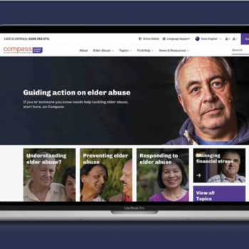 Laptop screen showing the Compass website homepage with elder abuse support resources.